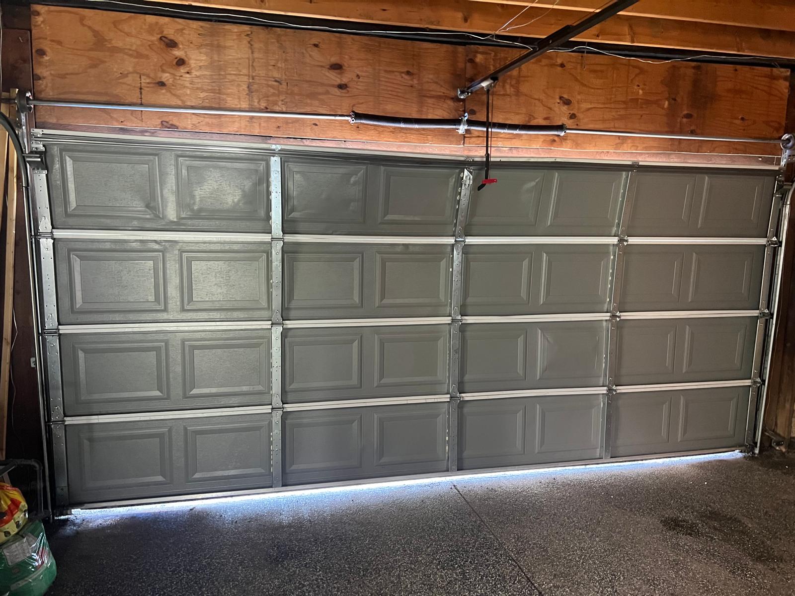 Interior view showing the complete garage door hardware and spring system
